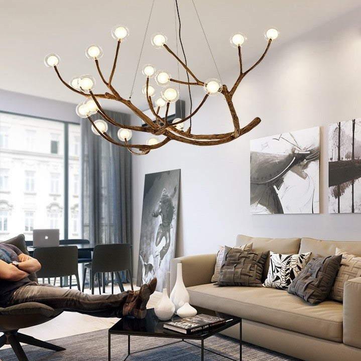 Lustre branche d’arbre orné de boules de verre