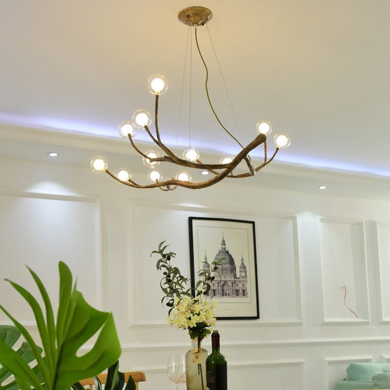 Lustre branche d’arbre orné de boules de verre