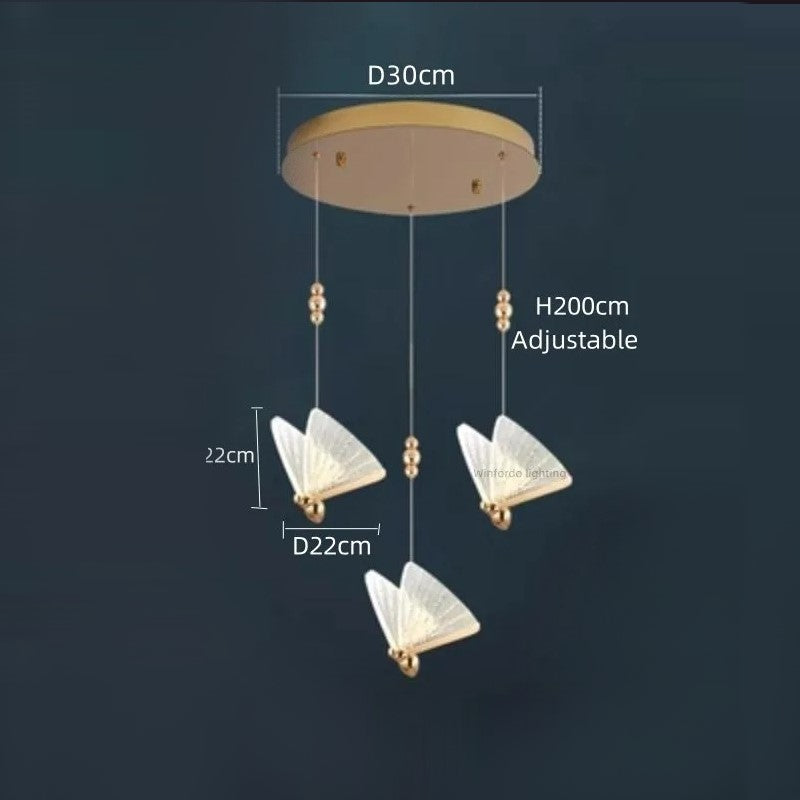 Suspension forme de papillon or et verre