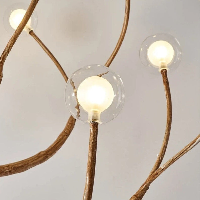 Lustre branche d’arbre orné de boules de verre