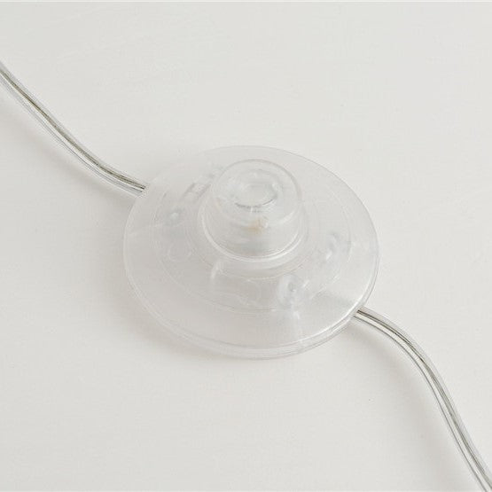 Lampadaire doré en plumes d’autruche