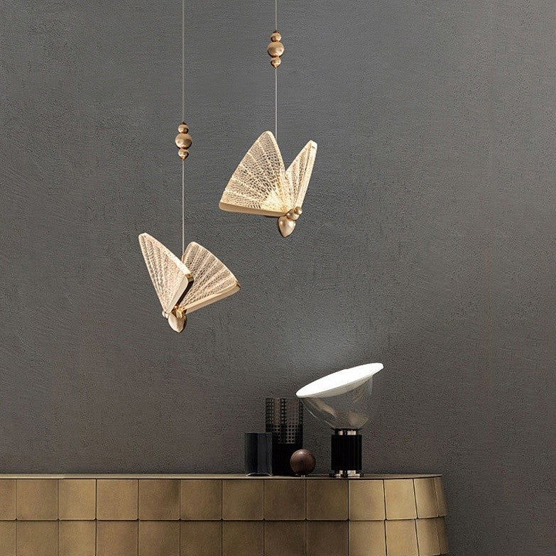 Suspension forme de papillon or et verre