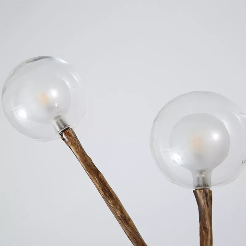 Lustre branche d’arbre orné de boules de verre