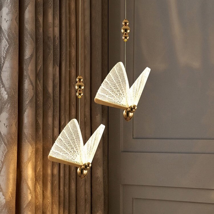 Suspension forme de papillon or et verre
