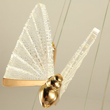 Suspension forme de papillon or et verre